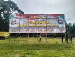 Banner Raksasa TMMD Ke-123 Kodim 0416/Bute Terbentang Di Lapangan Desa Teluk Kuali